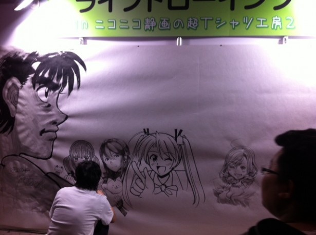 一日目のライブドローイングは左に大きく「はじめの一歩」が描かれているぞ